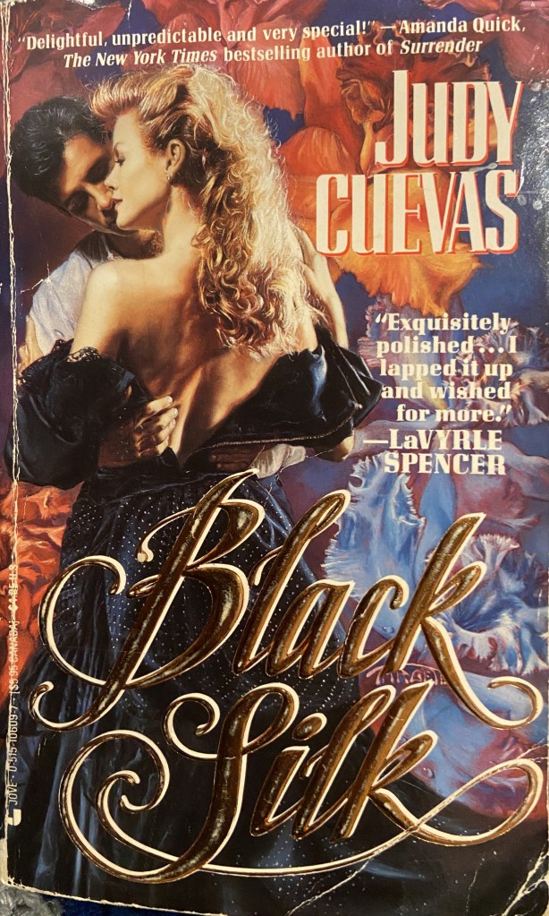 the cover of the book Black Silk by Judy Cuevas; a man embraces a woman, the back of her dress is open