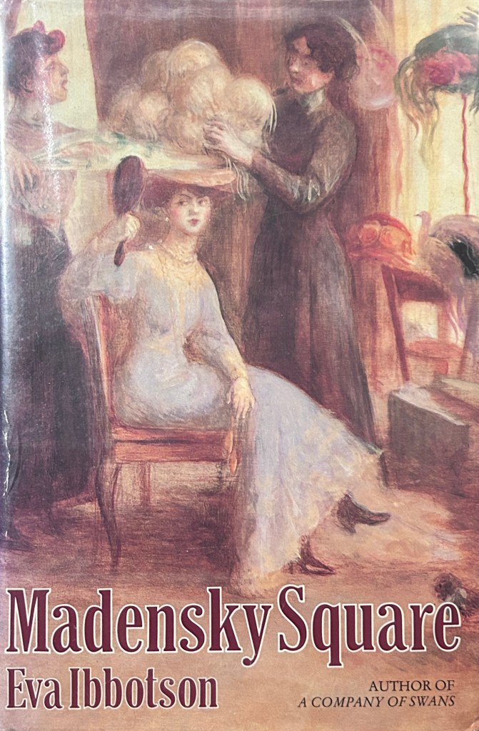 The cover of Madensky Square by Eva Ibbotson; a woman sits in a chair, gazing into a hand mirror; two women arrange the feathers of her hat.